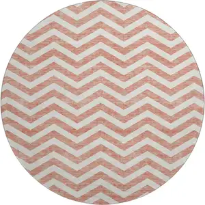 Photo of 8' Salmon And Ivory Chevron Washable Round Rug With UV Protection