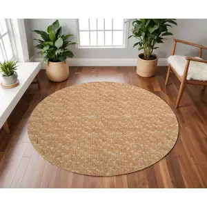 Photo of 8' Salmon And Ivory Geometric Washable Round Rug With UV Protection