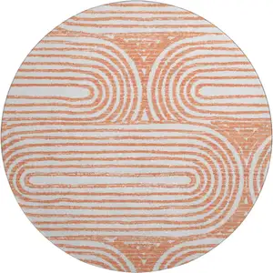 Photo of 8' Salmon And Ivory Geometric Washable Round Rug With UV Protection