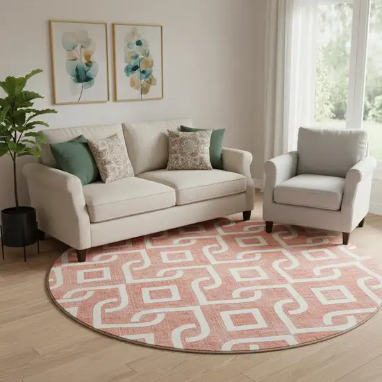 8' Salmon And Ivory Geometric Washable Round Rug With UV Protection Photo 1