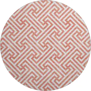 Photo of 8' Salmon And Ivory Geometric Washable Round Rug With UV Protection