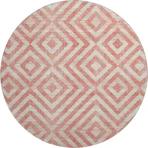 Photo of 8' Salmon And Ivory Geometric Washable Round Rug With UV Protection