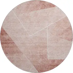 Photo of 8' Salmon And Ivory Geometric Washable Round Rug With UV Protection