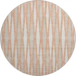 Photo of 8' Salmon And Ivory Geometric Washable Round Rug With UV Protection