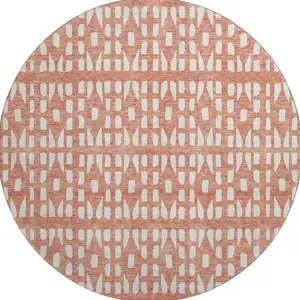 Photo of 8' Salmon And Ivory Geometric Washable Round Rug With UV Protection