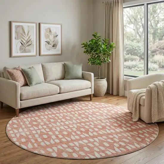 8' Salmon And Ivory Geometric Washable Round Rug With UV Protection Photo 1