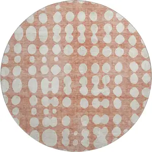 Photo of 8' Salmon And Ivory Polka Dot Washable Round Rug With UV Protection