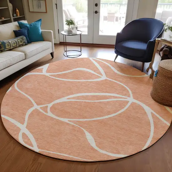 8' Salmon And Ivory Round Abstract Washable Indoor Outdoor Area Rug Photo 8