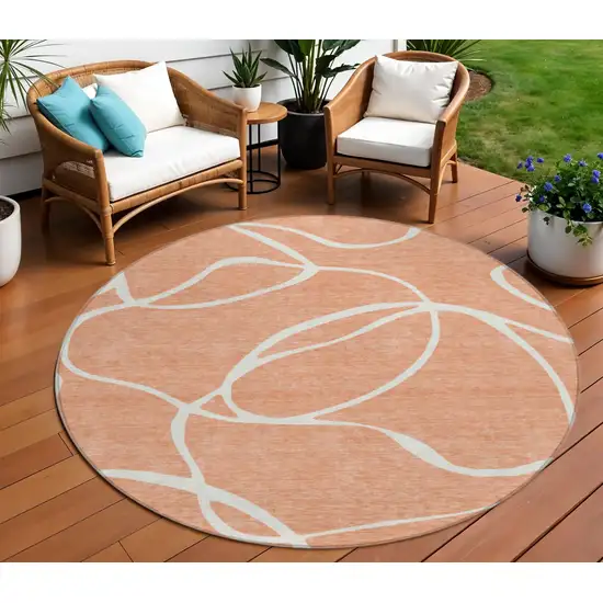 8' Salmon And Ivory Round Abstract Washable Indoor Outdoor Area Rug Photo 1