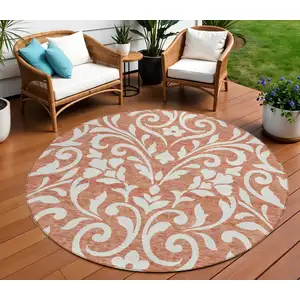Photo of 8' Salmon And Ivory Round Floral Washable Indoor Outdoor Area Rug