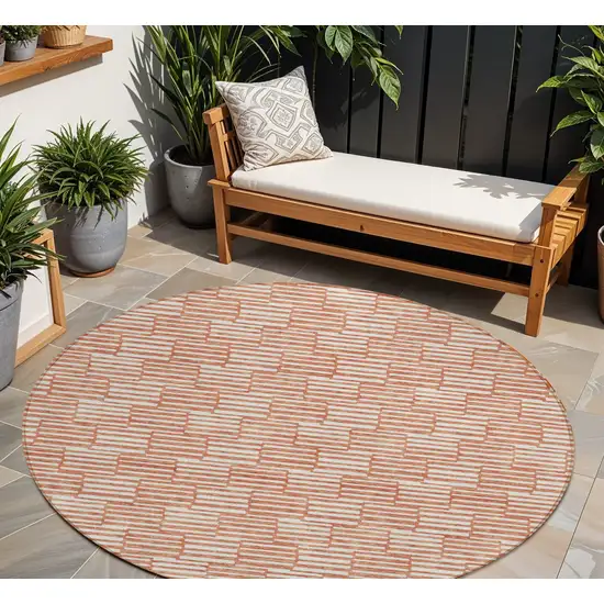 8' Salmon And Ivory Round Geometric Washable Indoor Outdoor Area Rug Photo 1