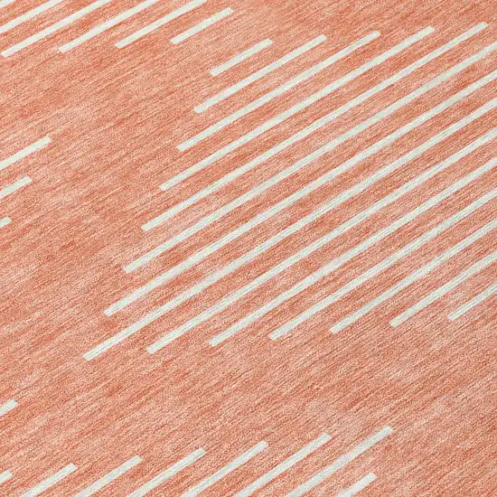 8' Salmon And Ivory Round Geometric Washable Indoor Outdoor Area Rug Photo 8