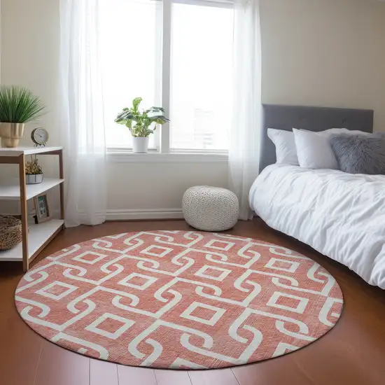 8' Salmon And Ivory Round Geometric Washable Indoor Outdoor Area Rug Photo 7