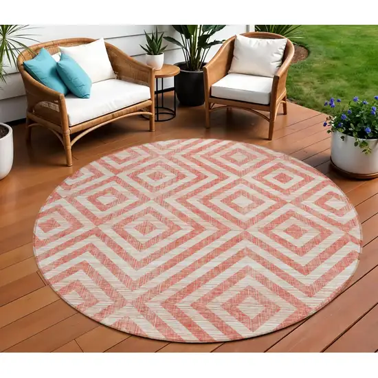 8' Salmon And Ivory Round Geometric Washable Indoor Outdoor Area Rug Photo 1