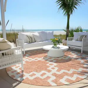 Photo of 8' Salmon And Ivory Round Geometric Washable Indoor Outdoor Area Rug