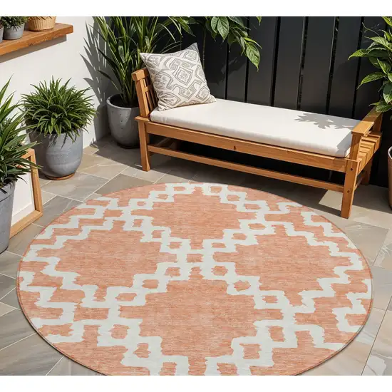 8' Salmon And Ivory Round Geometric Washable Indoor Outdoor Area Rug Photo 1