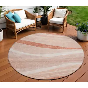 Photo of 8' Salmon And Pink Round Abstract Washable Indoor Outdoor Area Rug