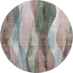 Photo of 8' Salmon Blue And Mauve Abstract Washable Round Rug With UV Protection