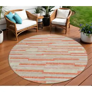 Photo of 8' Salmon Gray And Beige Round Striped Washable Indoor Outdoor Area Rug