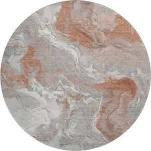 Photo of 8' Salmon Gray And Ivory Abstract Washable Round Rug With UV Protection
