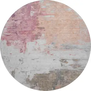 Photo of 8' Salmon Ivory And Brown Abstract Washable Round Rug With UV Protection