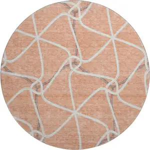 Photo of 8' Salmon Ivory And Gray Geometric Washable Round Rug With UV Protection