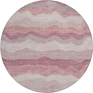 Photo of 8' Salmon Peach And Beige Round Striped Washable Indoor Outdoor Area Rug