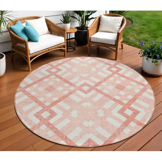 8' Salmon Peach And Ivory Round Geometric Washable Indoor Outdoor Area Rug Photo 1