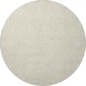 Photo of 8' Sand And Ivory Geometric Washable Round Rug With UV Protection