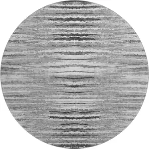 Photo of 8' Silver And Gray Striped Washable Round Rug With UV Protection