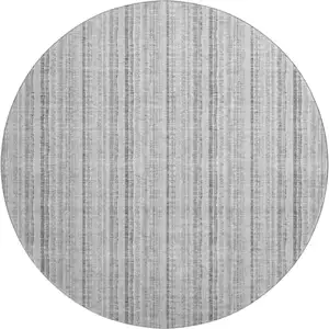 Photo of 8' Silver And Gray Striped Washable Round Rug With UV Protection
