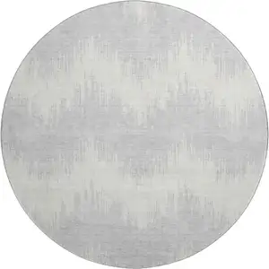 Photo of 8' Silver And Ivory Chevron Washable Round Rug With UV Protection