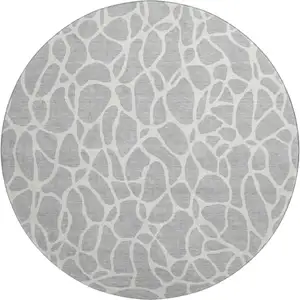 Photo of 8' Silver And Ivory Geometric Washable Round Rug With UV Protection
