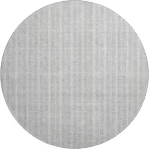 Photo of 8' Silver And Ivory Striped Washable Round Rug With UV Protection
