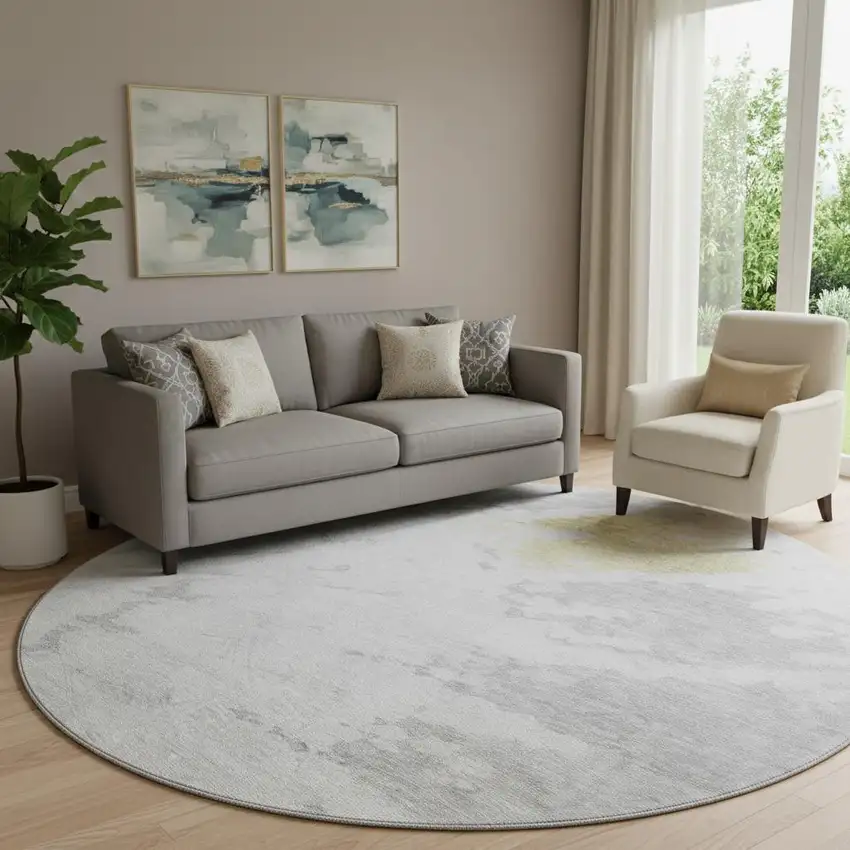 8' Silver Gold And Ivory Abstract Washable Round Rug With UV Protection Photo 1