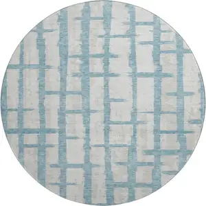 Photo of 8' Sky Blue And Beige Striped Washable Round Rug With UV Protection