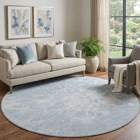 8' Sky Blue And Ivory Abstract Washable Round Rug With UV Protection Photo 1