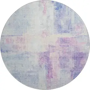 Photo of 8' Sky Blue And Ivory Abstract Washable Round Rug With UV Protection