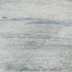 Photo of 8' Sky Blue And Ivory Abstract Washable Round Rug With UV Protection