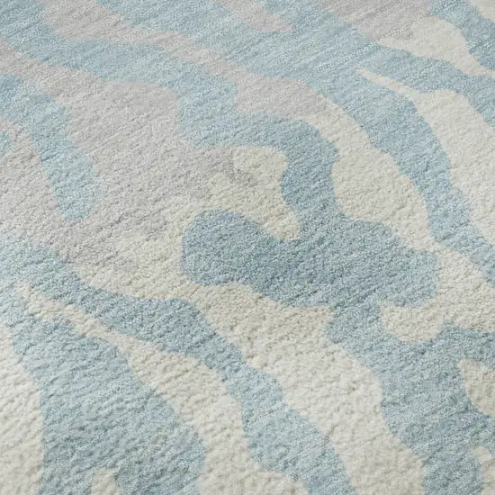 8' Sky Blue And Ivory Animal Print Washable Round Rug With UV Protection Photo 9