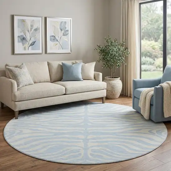 8' Sky Blue And Ivory Animal Print Washable Round Rug With UV Protection Photo 1