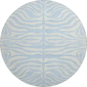 Photo of 8' Sky Blue And Ivory Animal Print Washable Round Rug With UV Protection