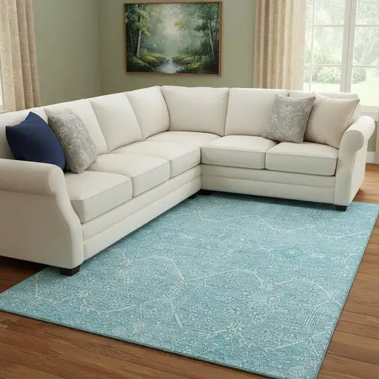 8' Sky Blue And Ivory Floral Washable Area Rug With UV Protection Photo 2