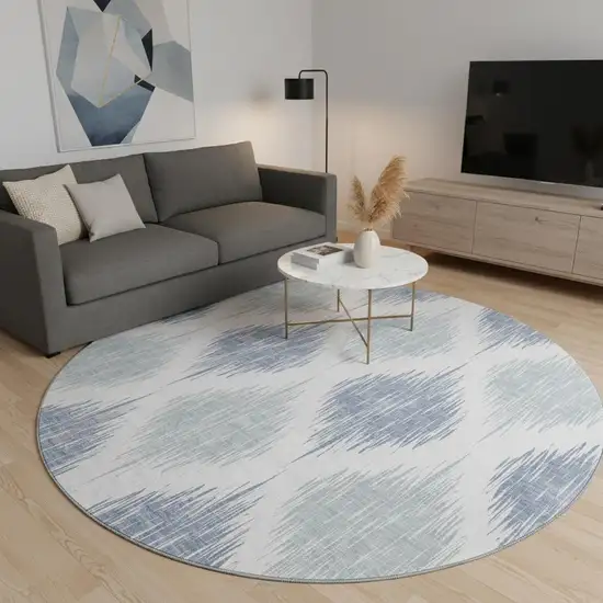 8' Sky Blue And Ivory Ikat Washable Round Rug With UV Protection Photo 2