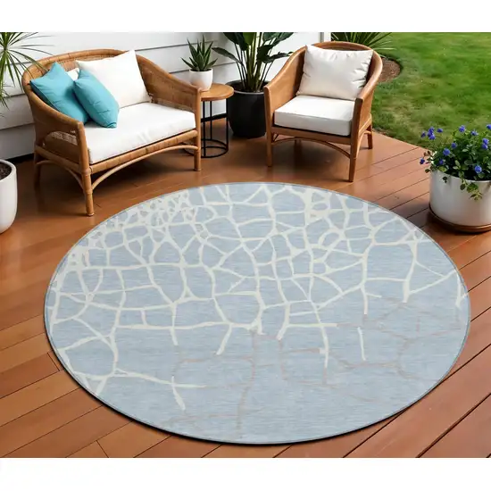 8' Sky Blue And Ivory Round Abstract Washable Indoor Outdoor Area Rug Photo 1