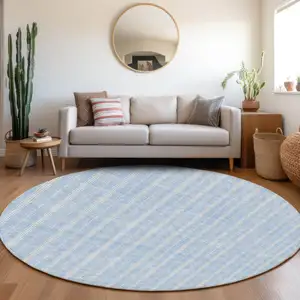 Photo of 8' Sky Blue And Ivory Round Striped Washable Indoor Outdoor Area Rug