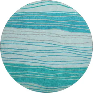 Photo of 8' Sky Blue And Teal Blue Striped Washable Round Rug With UV Protection