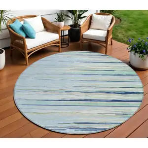 Photo of 8' Sky Blue Aqua And Gray Round Striped Washable Indoor Outdoor Area Rug