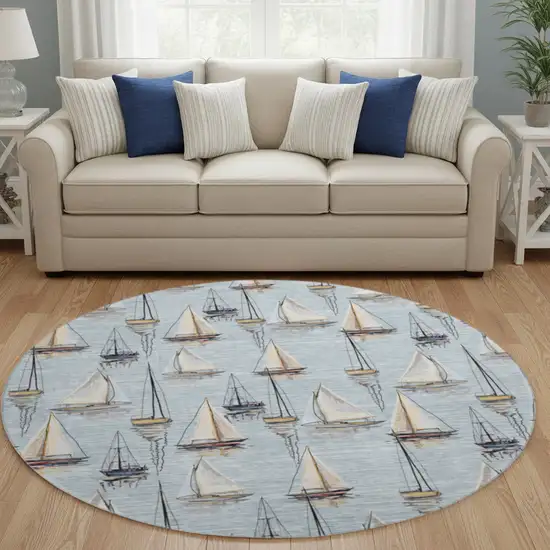 8' Sky Blue Gold And Ivory Nautical Washable Round Rug With UV Protection Photo 1