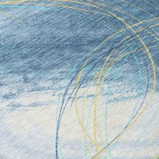 8' Sky Blue Gold And Ivory Round Abstract Washable Indoor Outdoor Area Rug Photo 9